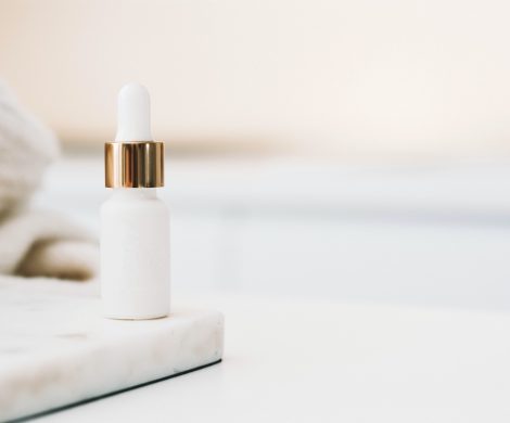 white drop bottle on white surface